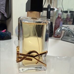 Yves Saint Laurent Gold and Black Perfume Bottle